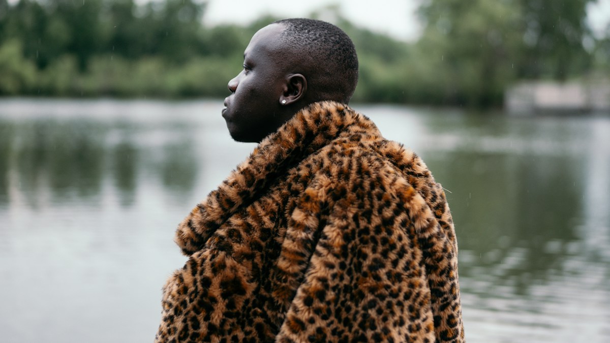 Woman wearing a brown and black leopard print coat street style
